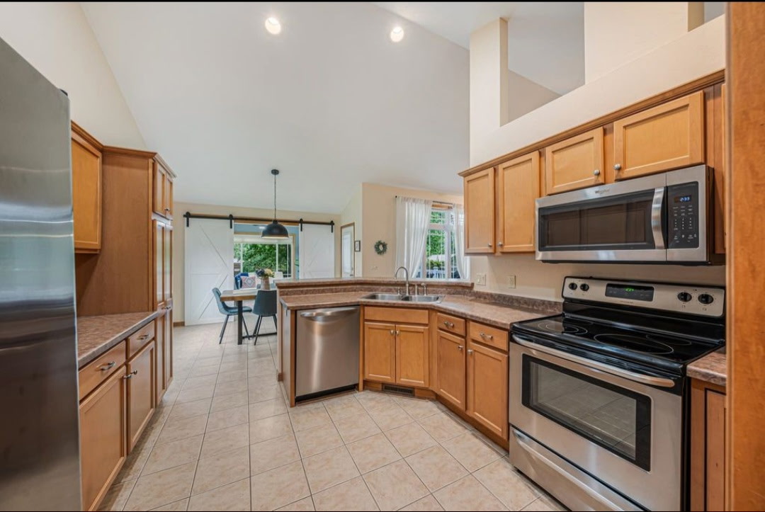Kitchen with wood cabinets and stainless appliances, 646 S Lincoln St, Hortonville WI
