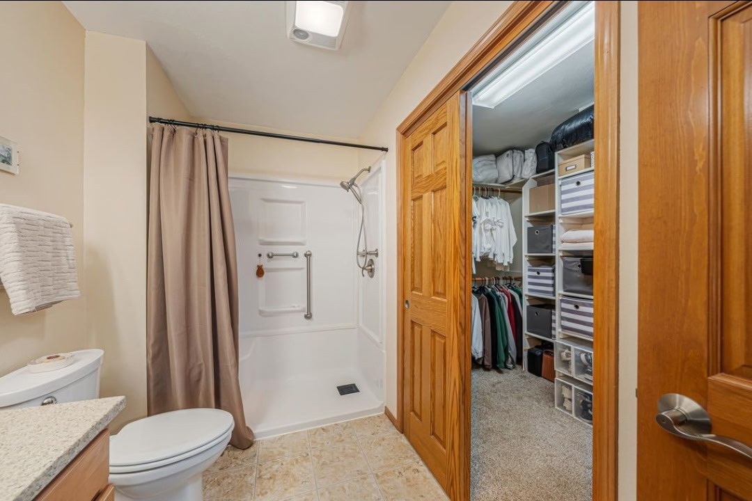 Primary bath with walk-in shower and walk-in closet, 646 S Lincoln St, Hortonville WI